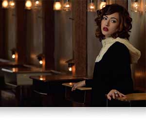 Low light portrait of a woman shot with the AF-S NIKKOR 300mm f/4E PF ED VR lens