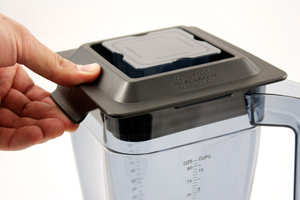 Rubber lid with latches on 2-sides, seals the lid to the container so it won't come loose during use. The removable cap in the center of lid lets you add ingredients during a blending cycle. 82oz. container with measurement markings. Made of durable Eastman Tritan Copolyester plastic. BPA-Free. Stainless steel blade assembly. 