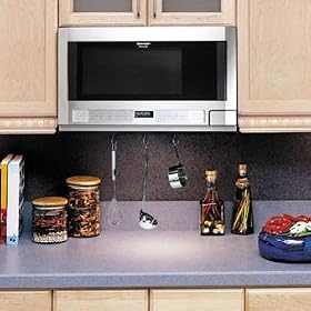 Sharp R1214 1.5 Cu. Ft. Over-the-Counter Microwave Oven with 1,100 Cooking Watts and... by 